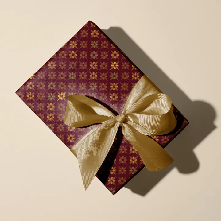 Gift wrap with a gold bow