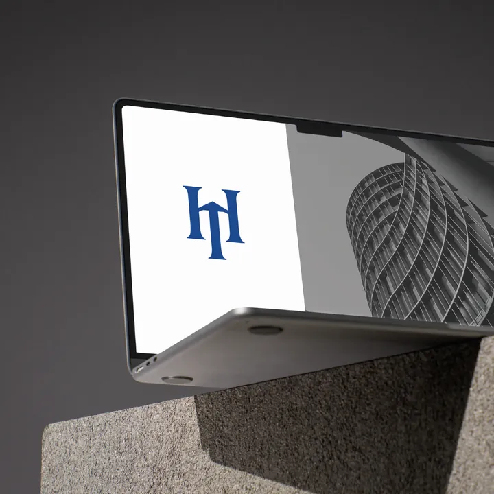 HunTR Advisory monogram on a laptop